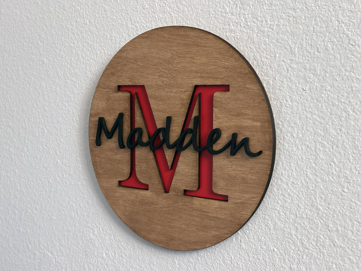 Custom monogram sign with name overlay. Variety of colors and wood stain options to choose from. Makes a great gift for friends, loved ones, teacher appreciation. Approximately 11.75" in diameter. Handmade by Space Rubber Ducky Designs.