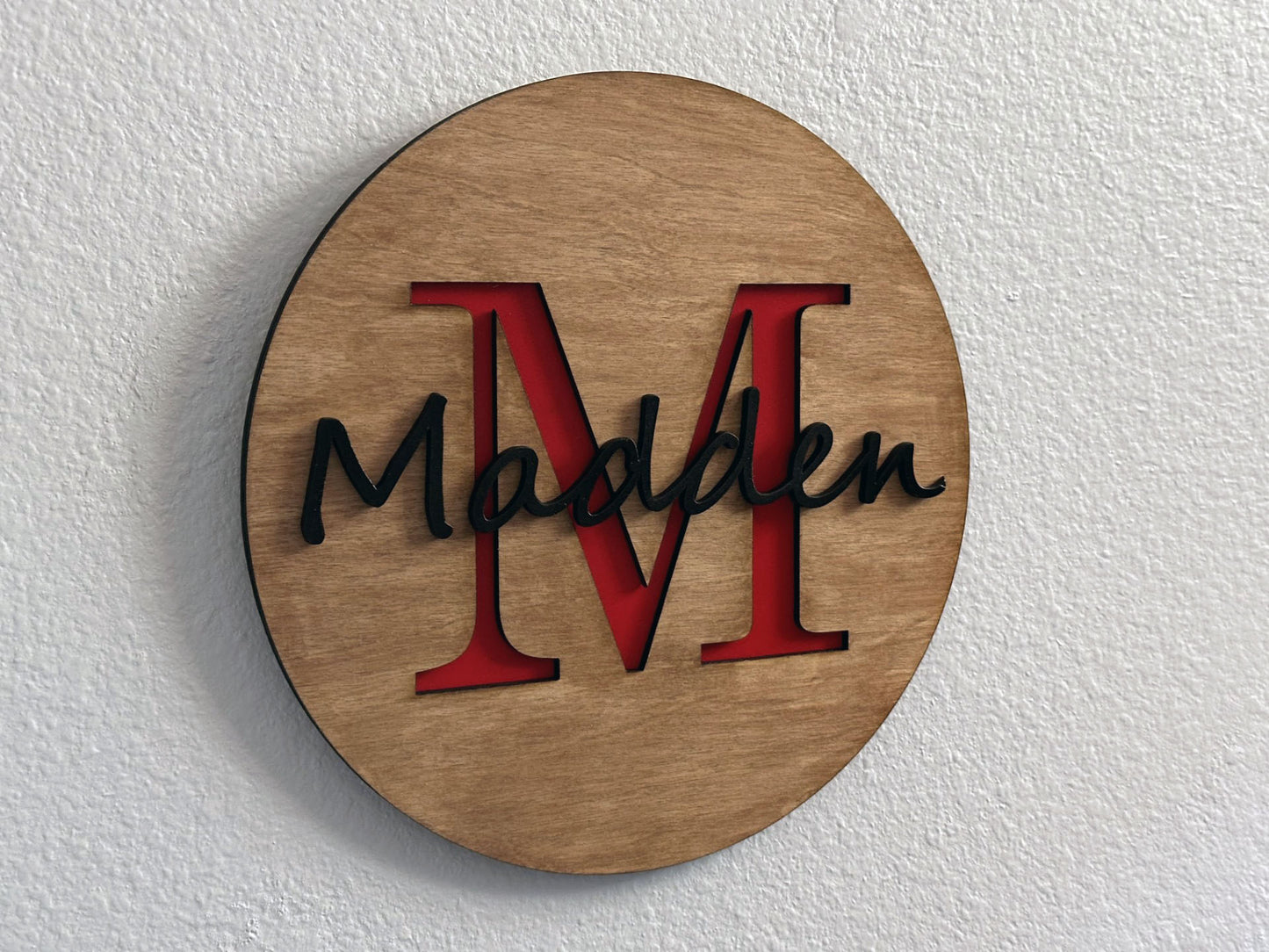 Custom monogram sign with name overlay. Variety of colors and wood stain options to choose from. Makes a great gift for friends, loved ones, teacher appreciation. Approximately 11.75" in diameter. Handmade by Space Rubber Ducky Designs.