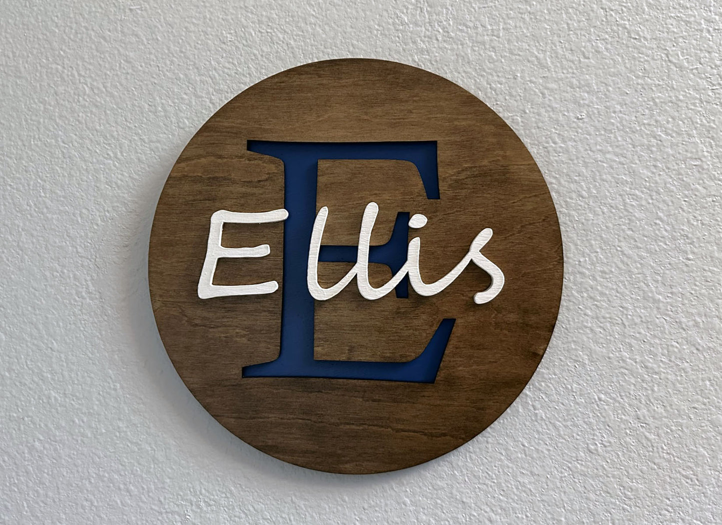Custom monogram sign with name overlay. Variety of colors and wood stain options to choose from. Makes a great gift for friends, loved ones, teacher appreciation. Approximately 11.75" in diameter. Handmade by Space Rubber Ducky Designs.