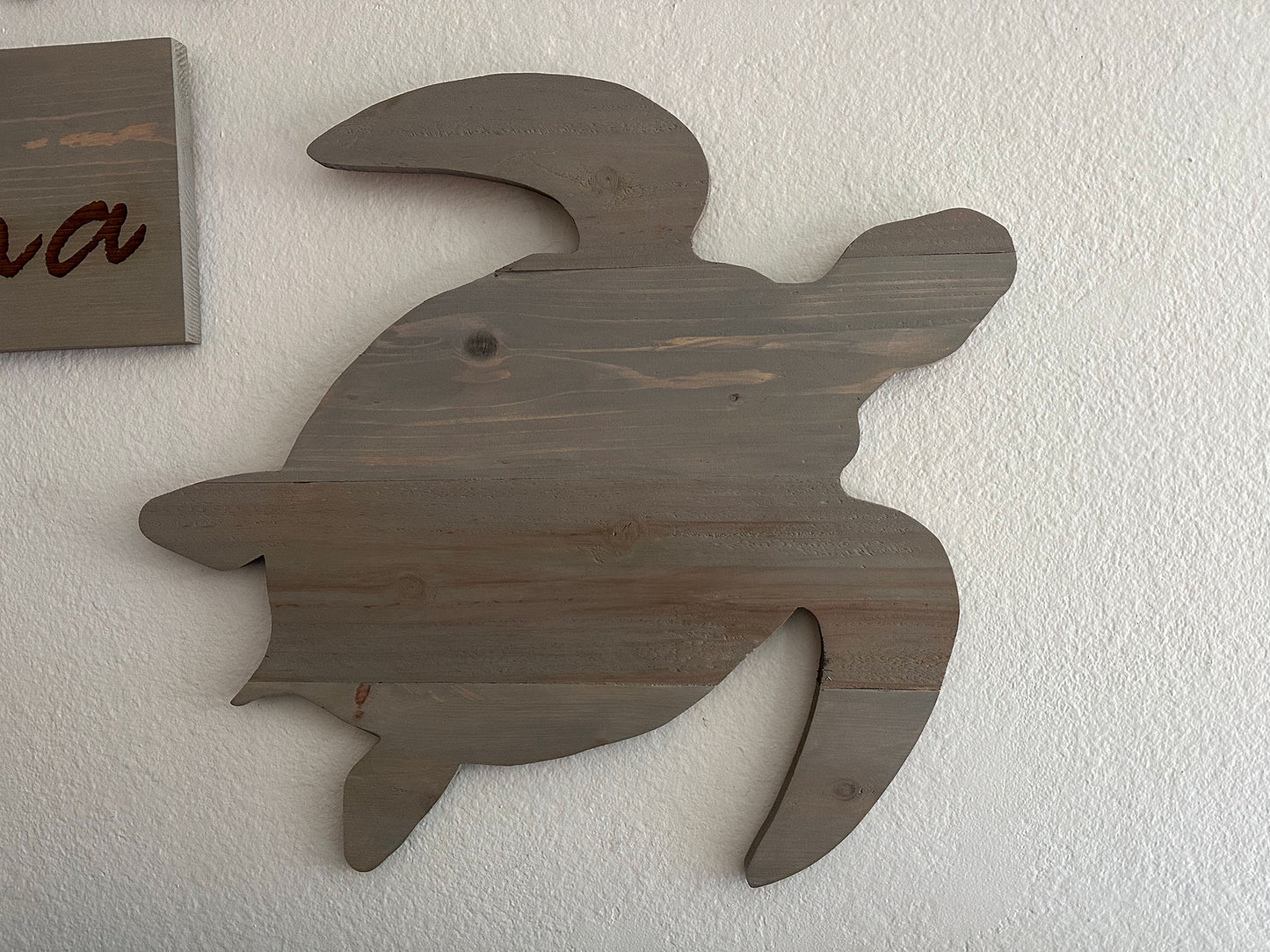 Custom handmade wood turtle wall art. Set of 4 turtles includes a board with Ohana laser engraved. Each piece includes mounting brackets and wall anchors.