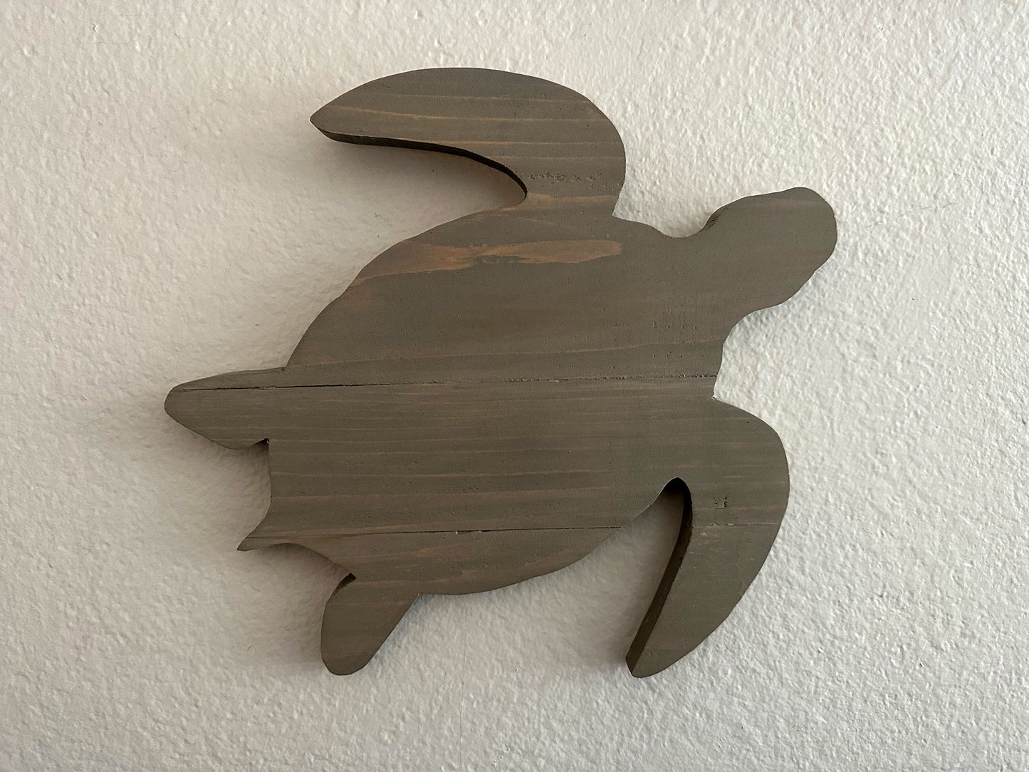 Custom handmade wood turtle wall art. Set of 4 turtles includes a board with Ohana laser engraved. Each piece includes mounting brackets and wall anchors.