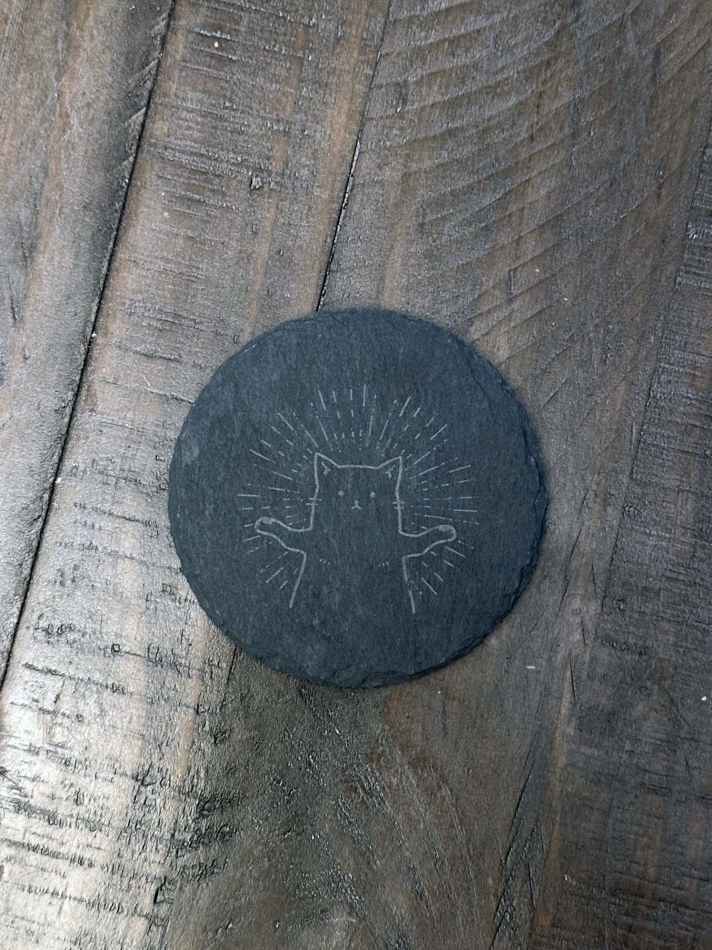 Add humor and style to your home with these laser engraved slate coasters with playful cat designs. The purfect gift, stocking stuffer or house warming gift.