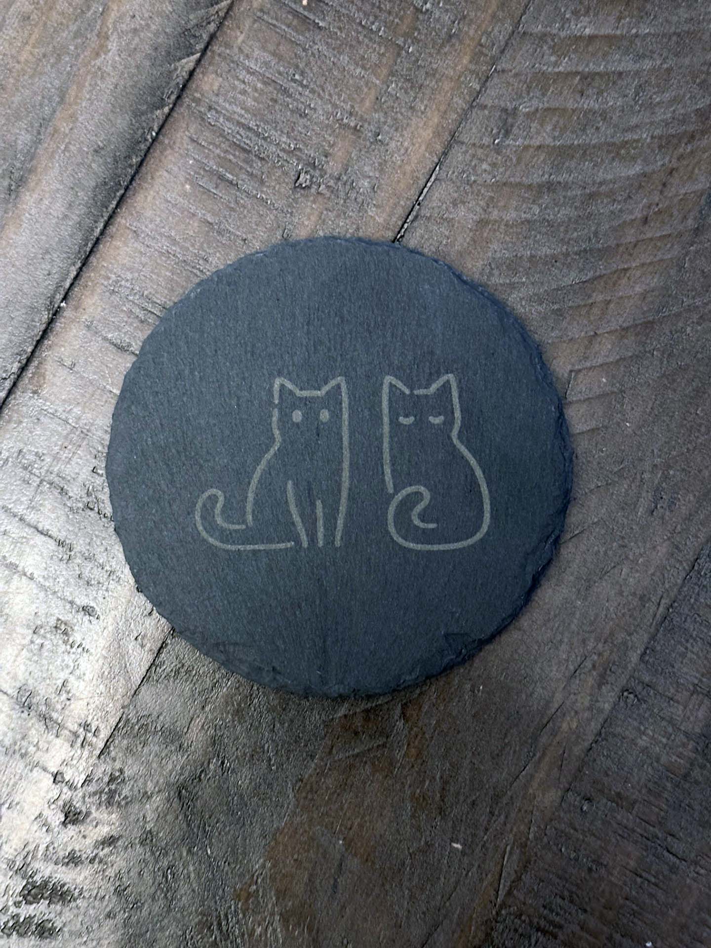 Add humor and style to your home with these laser engraved slate coasters with playful cat designs. The purfect gift, stocking stuffer or house warming gift.
