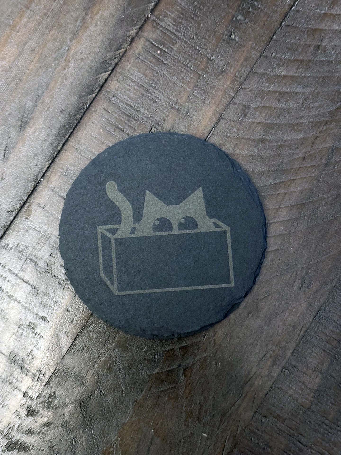 Add humor and style to your home with these laser engraved slate coasters with playful cat designs. The purfect gift, stocking stuffer or house warming gift.