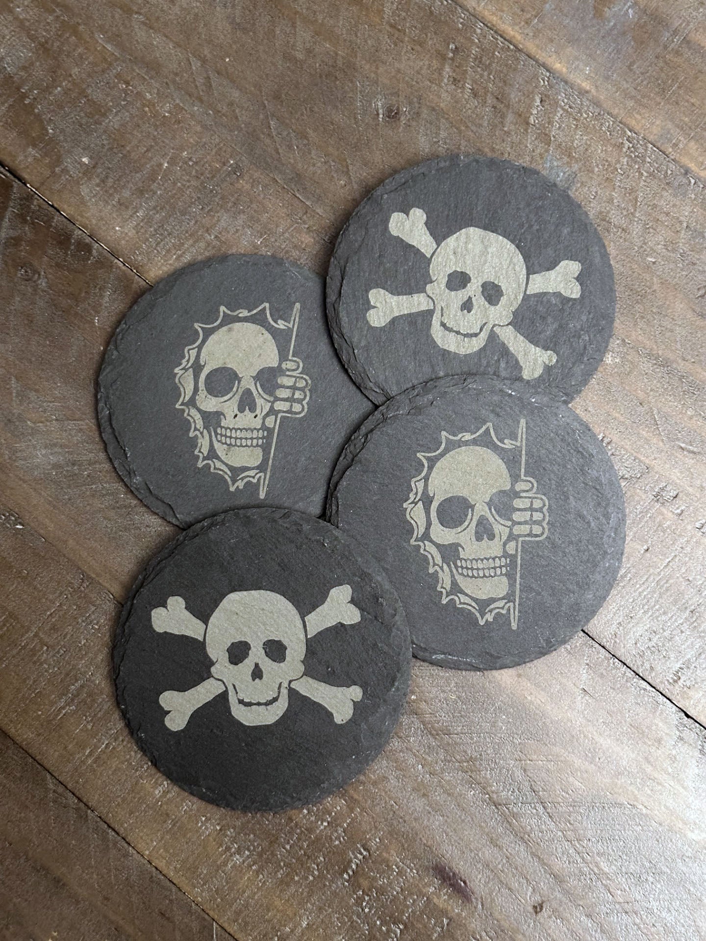Enjoy a beverage while protecting your tabletops with these creepy, chilling, skeleton themed slate coasters. You might say they're "spooky, scary, skeletons".... The perfect stocking stuffer, groomsman or house warming gift. These slate coasters will be right at home in any man cave or she shed.