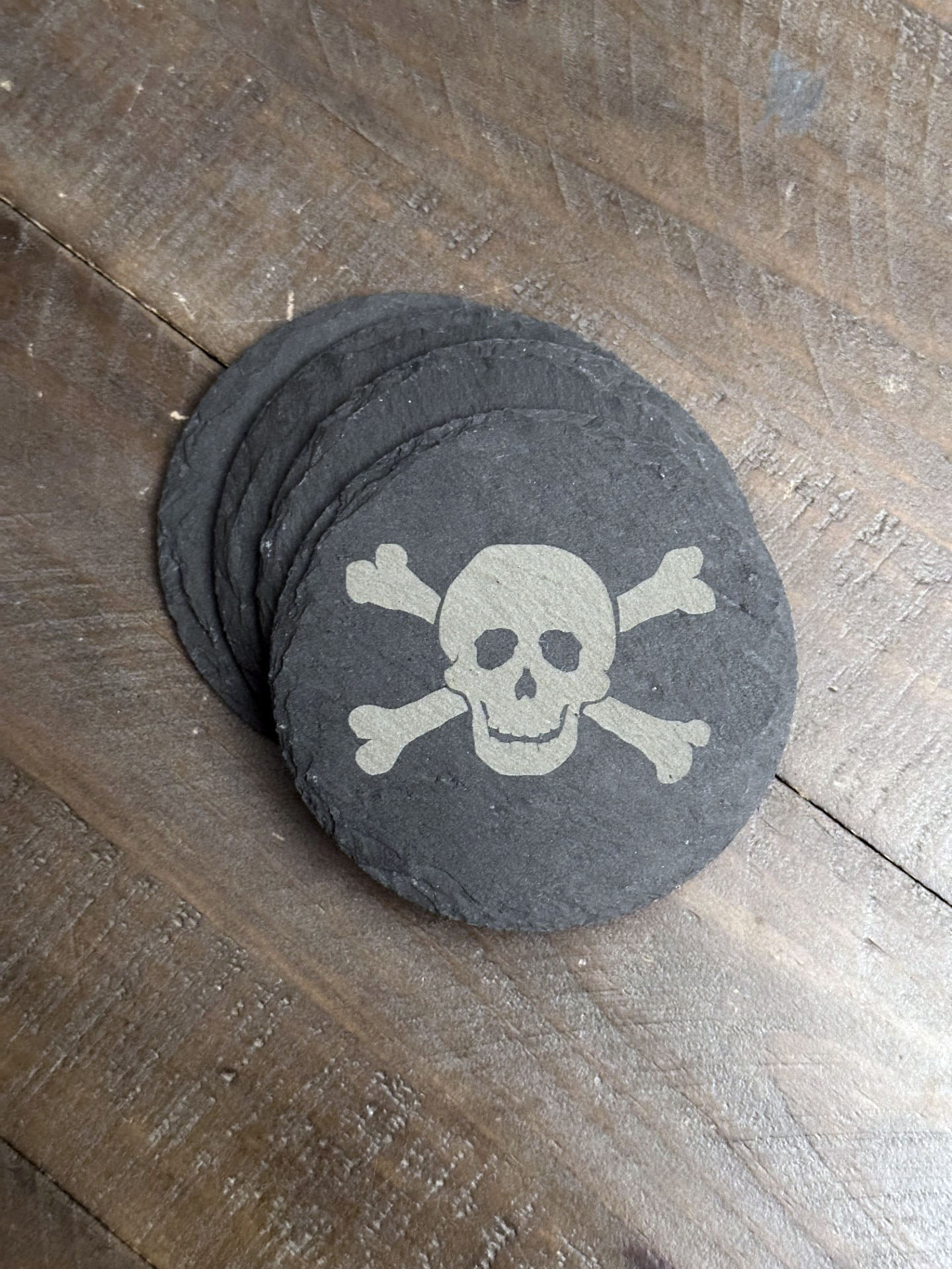 Enjoy a beverage while protecting your tabletops with these creepy, chilling, skeleton themed slate coasters. You might say they're "spooky, scary, skeletons".... The perfect stocking stuffer, groomsman or house warming gift. These slate coasters will be right at home in any man cave or she shed.