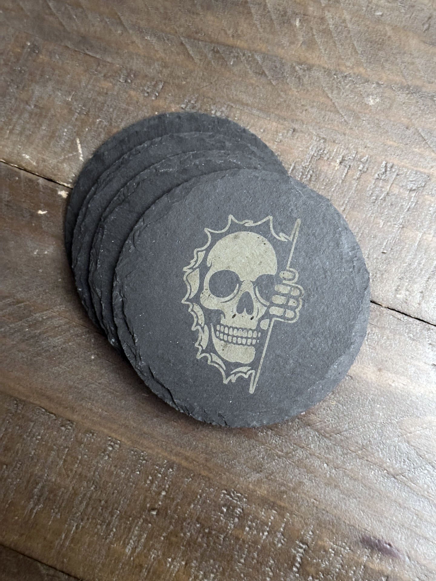 Enjoy a beverage while protecting your tabletops with these creepy, chilling, skeleton themed slate coasters. You might say they're "spooky, scary, skeletons".... The perfect stocking stuffer, groomsman or house warming gift. These slate coasters will be right at home in any man cave or she shed.