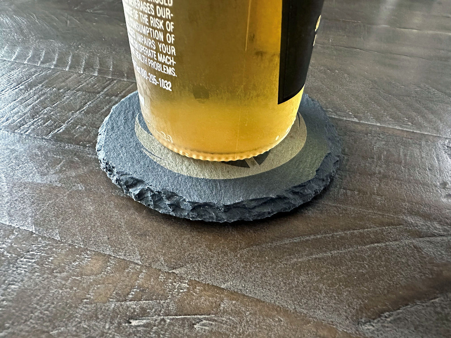 How do you make an octopus laugh? Ten-tickles! Enjoy a beverage while protecting your tabletops with these octopus themed slate coasters! The images are laser engraved onto each slate coaster and are permanent. They won't fade or wash off! Grab a set for that perfect groomsman or house warming gift. These slate coasters will also be right at home in any man cave or she shed. Makes a great holiday present or stocking stuffer, too! Coasters include padded feet attached.