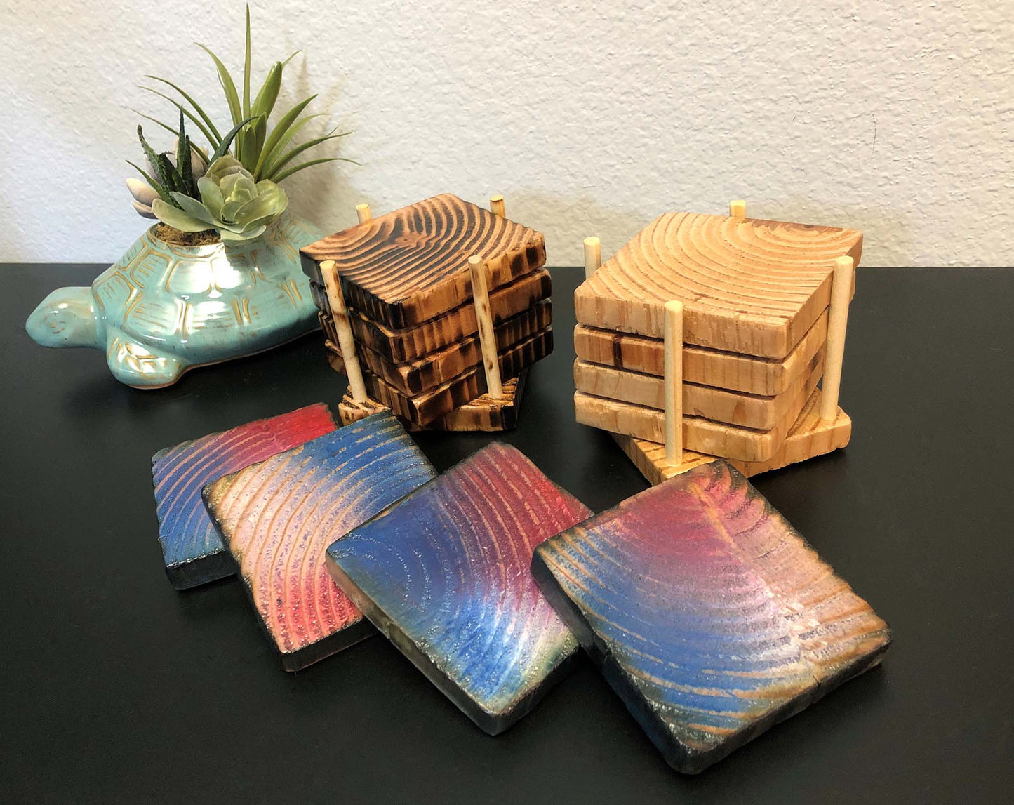 Rustic farmhouse wood coasters. Natural end grain pattern. Charred, burned and distressed. Patriotic red, white and blue distressed and burned. Set of 4 coasters and holder includes felt food pads. Handmade by Space Rubber Ducky Designs.