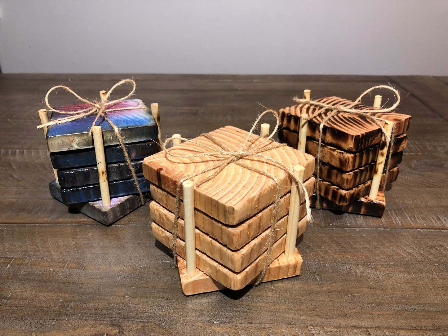 Rustic farmhouse wood coasters. Natural end grain pattern. Charred, burned and distressed. Patriotic red, white and blue distressed and burned. Set of 4 coasters and holder includes felt food pads. Handmade by Space Rubber Ducky Designs.