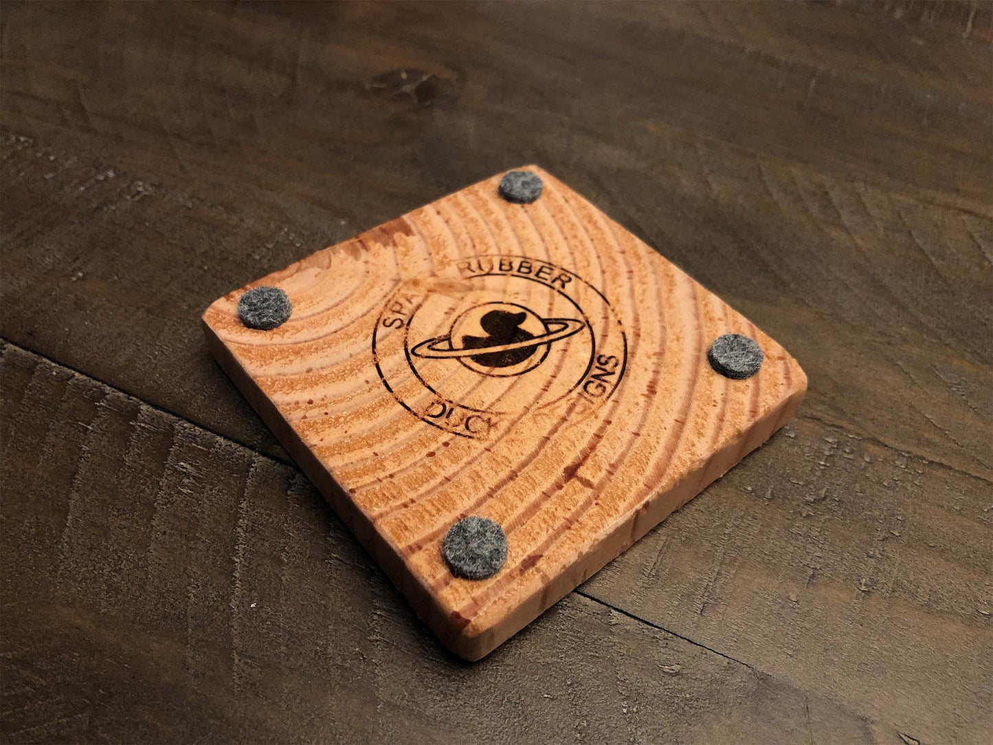 Rustic farmhouse wood coasters. Natural end grain pattern. Charred, burned and distressed. Patriotic red, white and blue distressed and burned. Set of 4 coasters and holder includes felt food pads. Handmade by Space Rubber Ducky Designs.