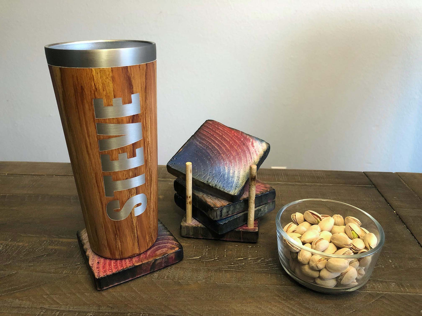 Rustic farmhouse wood coasters. Natural end grain pattern. Charred, burned and distressed. Patriotic red, white and blue distressed and burned. Set of 4 coasters and holder includes felt food pads. Handmade by Space Rubber Ducky Designs.