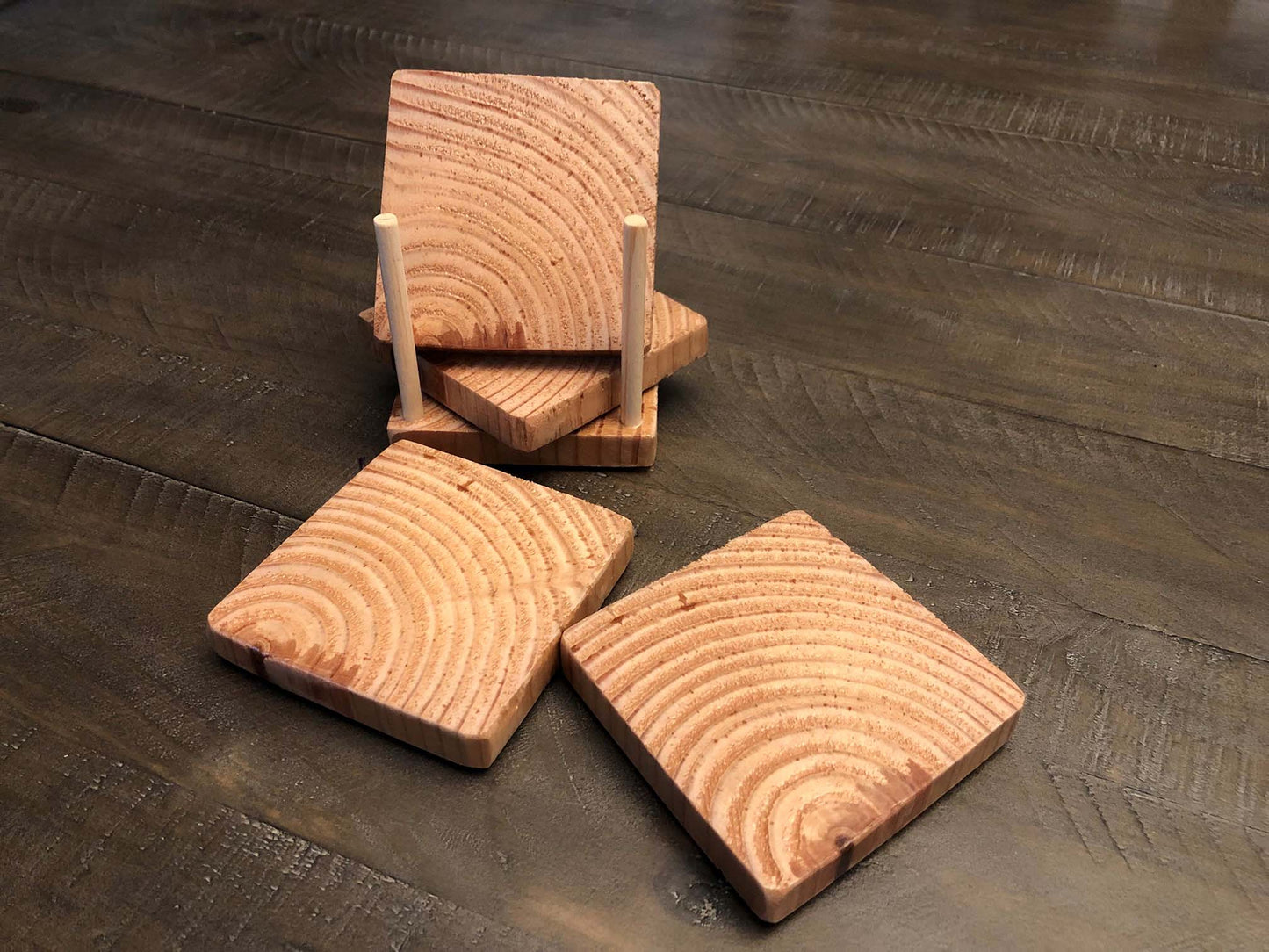 Rustic farmhouse wood coasters. Natural end grain pattern. Charred, burned and distressed. Patriotic red, white and blue distressed and burned. Set of 4 coasters and holder includes felt food pads. Handmade by Space Rubber Ducky Designs.