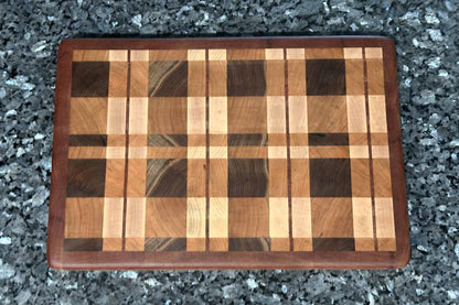 End grain cutting board with cherry, maple, black walnut, and mahogany hardwoods.
