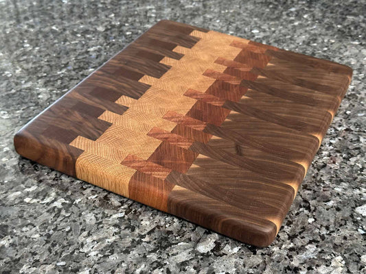 End grain cutting board with black walnut, mahogany, sapele, and oak hardwoods.