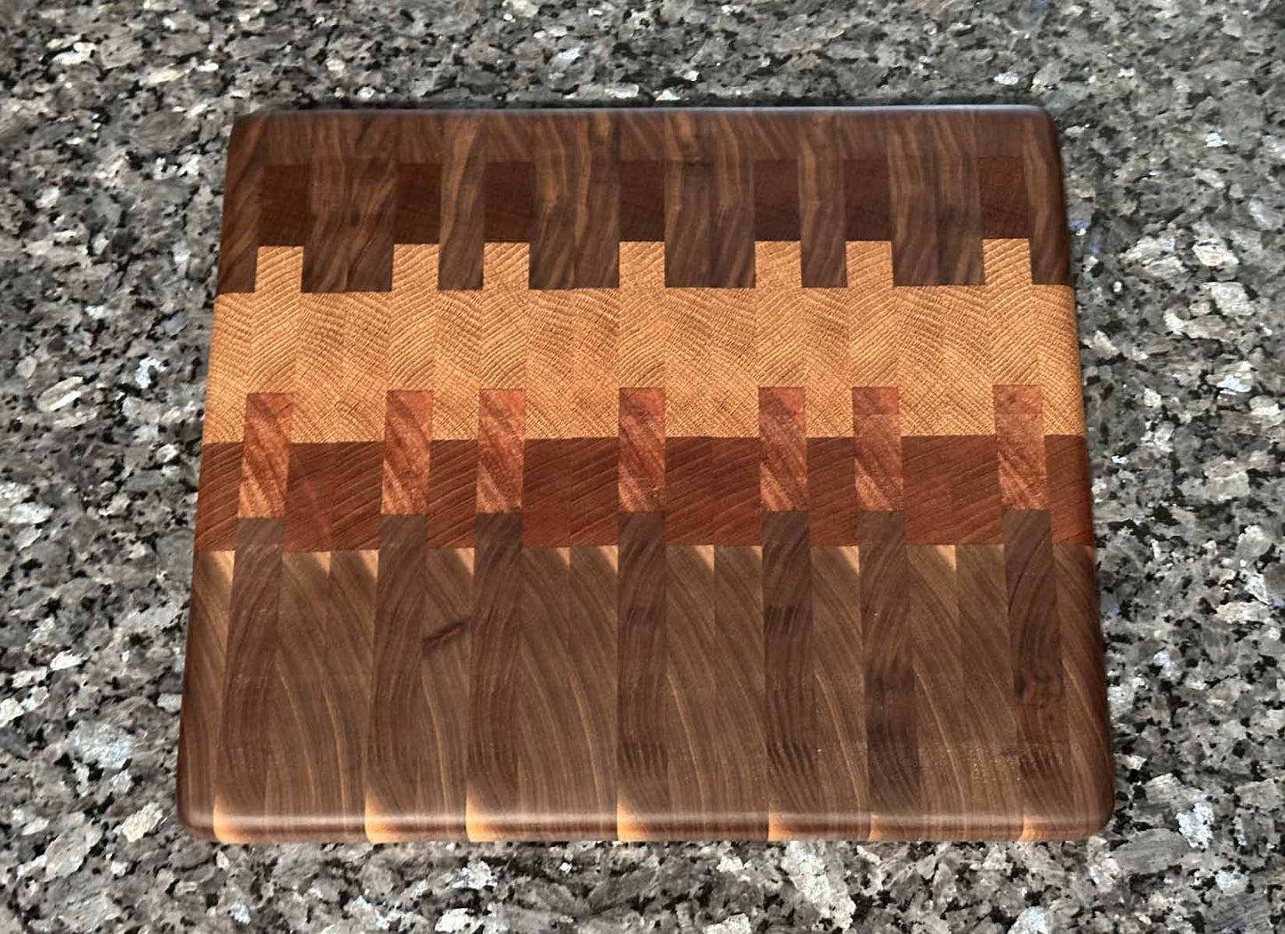 End grain cutting board with black walnut, mahogany, sapele, and oak hardwoods.