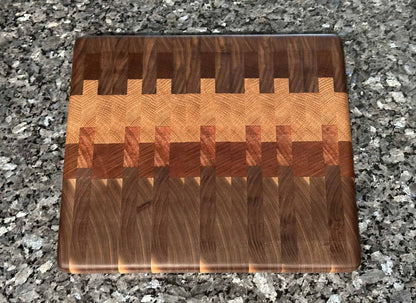 End grain cutting board with black walnut, mahogany, sapele, and oak hardwoods.