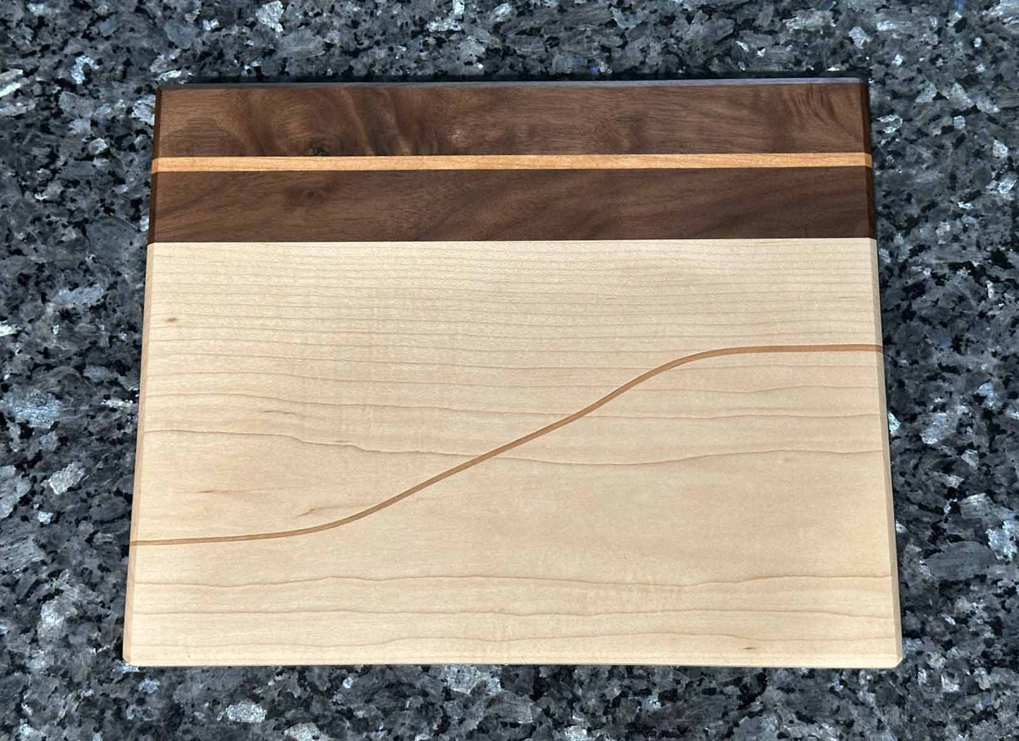 Long Grain Cutting Board with Black Walnut and Maple Hardwoods and Striking Cherry Accent by Space Rubber Ducky Designs.