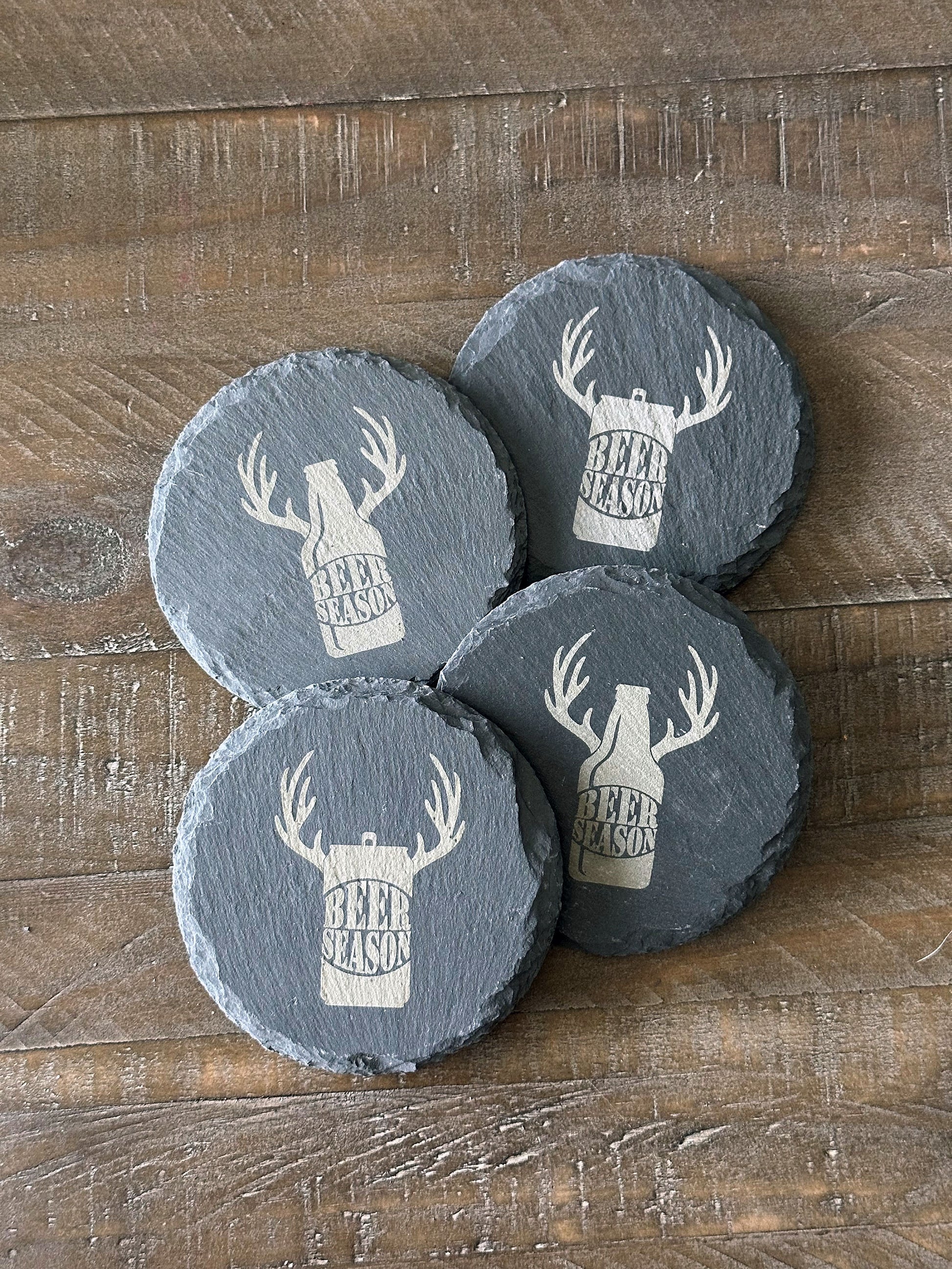 Enjoy a beverage while protecting your tabletops with these quirky beer themed slate coasters. Each set of 4 coasters features a different combination of beer themed sayings and images. The perfect stocking stuffer, groomsman or house warming gift. These slate coasters will be right at home in any man cave or she shed.