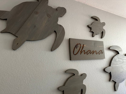 Custom handmade wood turtle wall art.  Set of 4 turtles includes a board with Ohana laser engraved.  Each piece includes mounting brackets and wall anchors.