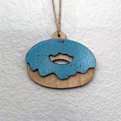 Handmade wood Christmas ornaments. Beach, turtle, Hawaiian, octopus, sports, patriotic, pop culture, Star Wars, and Marvel themed. And there's donuts! Variety of color options available. Custom and personalization options. Made by Space Rubber Ducky Designs in the USA.