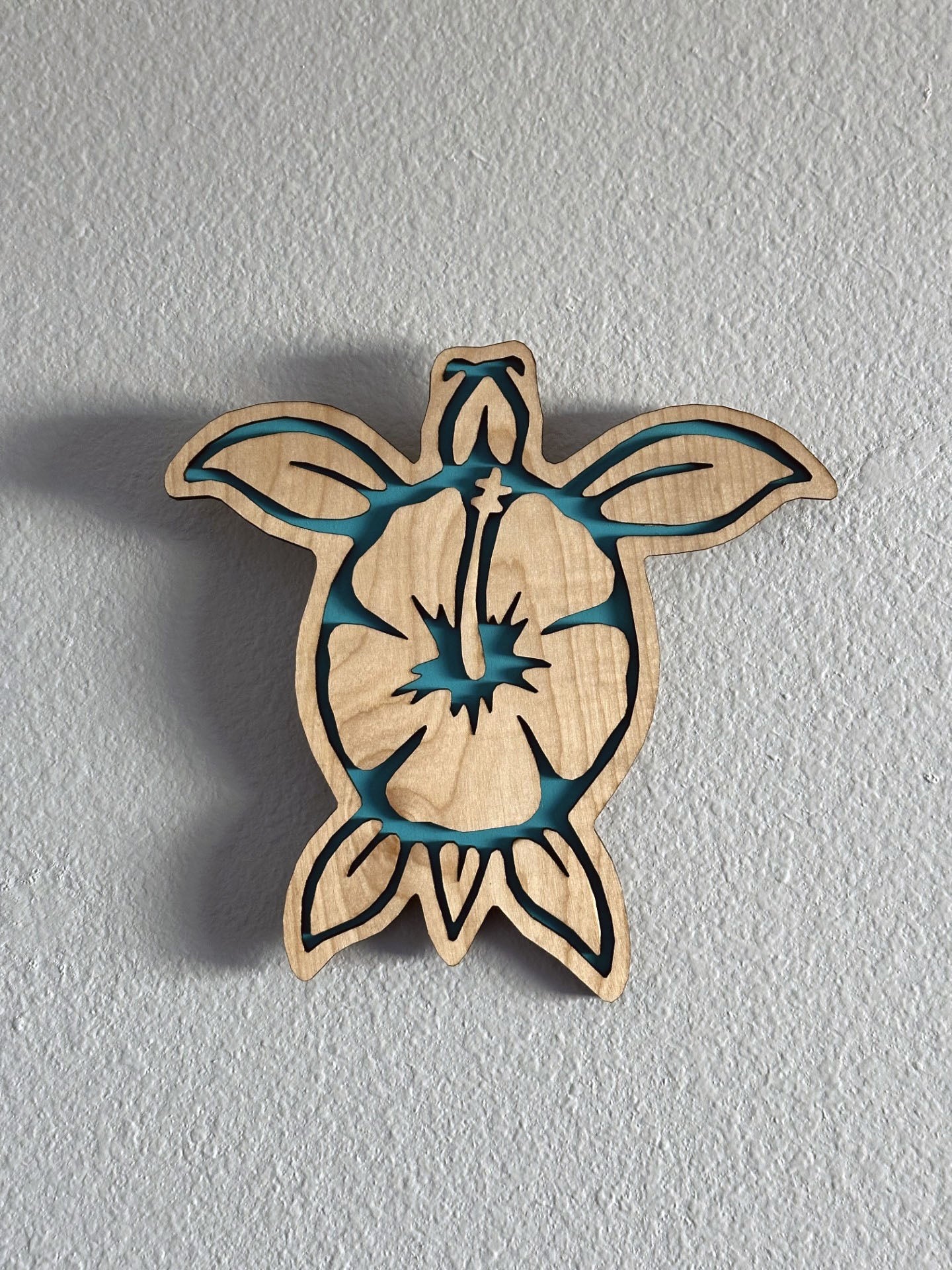 Brighten up your living space with some colorful turtle decor! Each piece of wall art features a sea turtle with hibiscus flower and an inlay color. Variety of colors and wood stains. A thoughtful gift for friends, loved ones, teacher appreciation! Handmade by Space Rubber Ducky Designs in Southern California, USA.