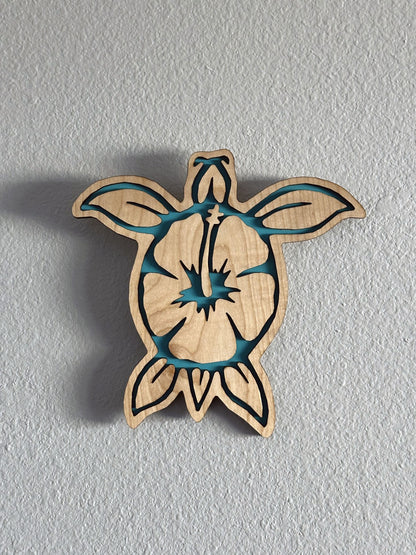 Brighten up your living space with some colorful turtle decor! Each piece of wall art features a sea turtle with hibiscus flower and an inlay color. Variety of colors and wood stains. A thoughtful gift for friends, loved ones, teacher appreciation! Handmade by Space Rubber Ducky Designs in Southern California, USA.